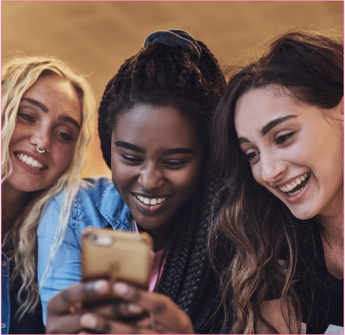 Friends sharing a laugh over Mixu's social media and instant messaging service